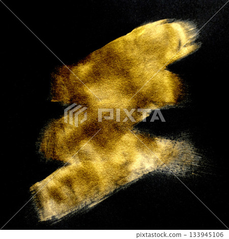 Abstract gold brush stroke on black canvas creates luminous warmth and texture 133945106