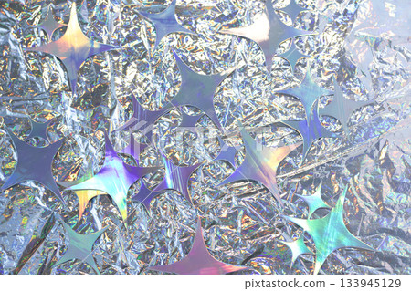 Iridescent holographic foil mosaic with star shapes and crumpled metallic texture background Iridescent holographic foil mosaic with star shapes and crumpled metallic texture background 133945129