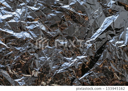 Abstract crumpled foil texture with bright reflections and metallic sheen for design projects Abstract crumpled foil texture with bright reflections and metallic sheen for design projects 133945162
