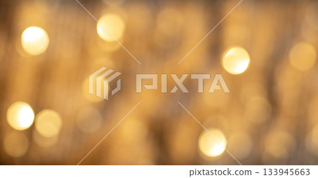 Soft Golden Bokeh Lights Create a Warm Abstract Background for Luxury, Festive, and Celebration Uses Soft Golden Bokeh Lights Create a Warm Abstract Background for Luxury, Festive, and Celebration Uses 133945663