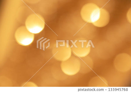 Soft golden bokeh lights create warm abstract glow for festive ambiance 133945768