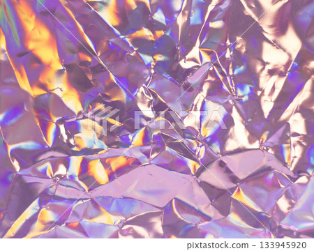 Iridescent Crumpled Foil Texture With Rainbow Colors And Glossy Reflections Iridescent Crumpled Foil Texture With Rainbow Colors And Glossy Reflections 133945920