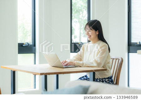 Woman working at home Woman working at home 133946589