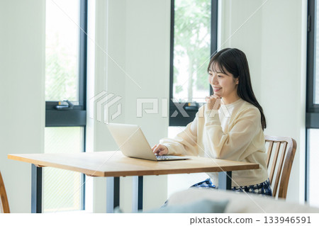 Woman working at home Woman working at home 133946591