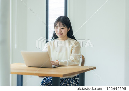 Woman working at home 133946596