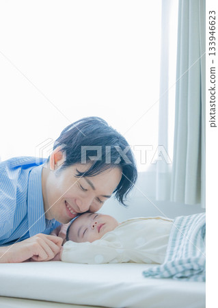 Father putting the baby to sleep Father putting the baby to sleep 133946623