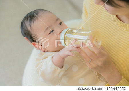 A family relaxing in the living room 133946652