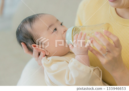 A family relaxing in the living room 133946653