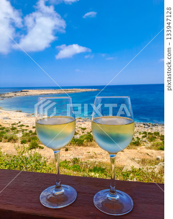 Two glasses of wine on a terrace overlooking the Mediterranean Sea Two glasses of wine on a terrace overlooking the Mediterranean Sea 133947128