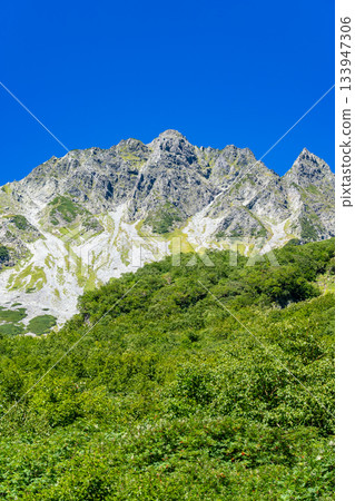 View of Mt. Karasawa and Mt. Karasawa-yari from the Karasawa tent site. Climbing Mt. Kitahotaka in the Northern Alps. View of Mt. Karasawa and Mt. Karasawa-yari from the Karasawa tent site. Climbing Mt. Kitahotaka in the Northern Alps. 133947306
