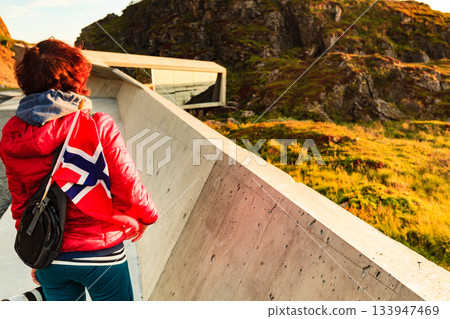 Andoya island sea coast and tourist with norwegian flag Andoya island sea coast and tourist with norwegian flag 133947469