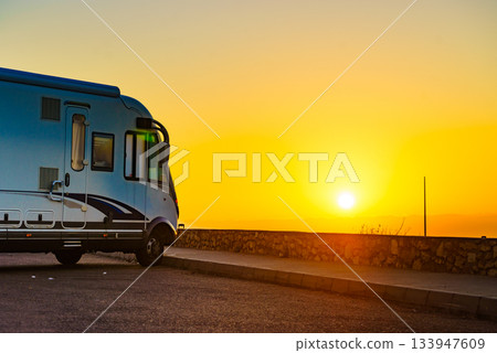 Camper car on coast at sunrise Camper car on coast at sunrise 133947609