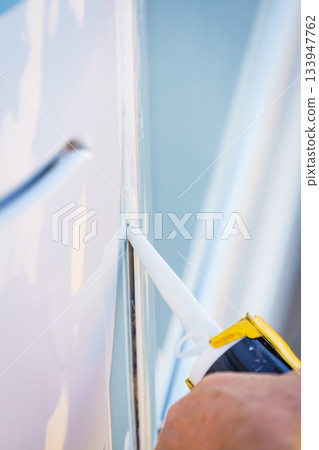 Applying silicon on caravan body Applying silicon on caravan body 133947762