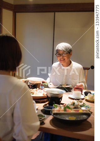 A relaxing dinner time for parents and children 133947775