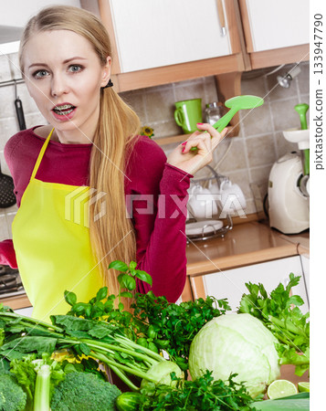 Woman having green vegetables thinking about cooking 133947790