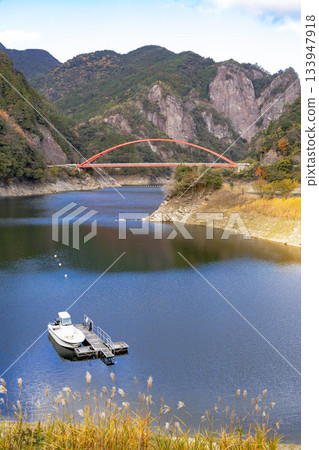 Red bridge and heart-shaped rock at Hinatagami Valley in Yame City 133947918