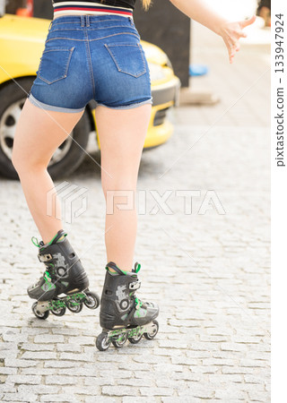 Sexy woman wearing roller skates Sexy woman wearing roller skates 133947924