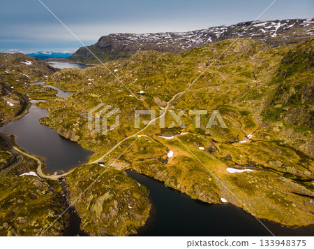 Aerial view. Road and lakes in mountains Norway Aerial view. Road and lakes in mountains Norway 133948375