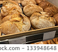 Freshly baked artisan bread loaves displayed in a bakery 133948648