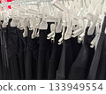Fashion display of black clothing in a retail store setting 133949554
