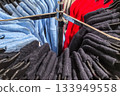 Colorful sweaters arranged on display in a cozy retail store 133949558