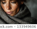 Warm moments wrapped in a cozy shawl during a quiet evening 133949606