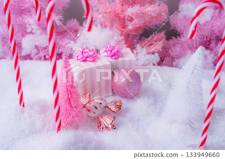 Pink Christmas Holiday Scene with Gifts Candy and Frosted Trees 133949660