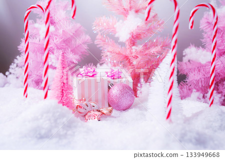 Pink Christmas Holiday Scene with Gifts Candy and Frosted Trees Pink Christmas Holiday Scene with Gifts Candy and Frosted Trees 133949668