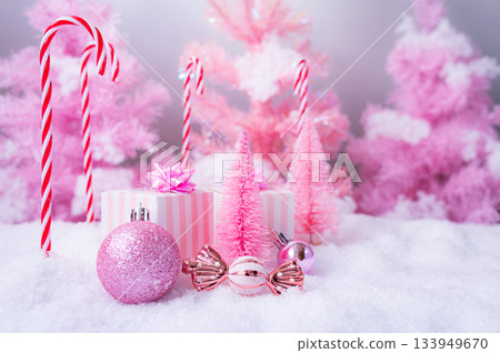 Pink Christmas Holiday Scene with Gifts Candy and Frosted Trees 133949670