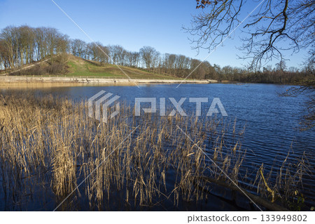 High water levels at Annas Hoeve in Hilversum during summer season with trees and grass in view 133949802