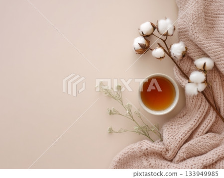 Cozy cup of tea with knitted blanket and cotton Cozy cup of tea with knitted blanket and cotton 133949985
