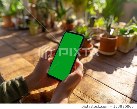 Smartphone mockup in green eco workspace Smartphone mockup in green eco workspace 133950063