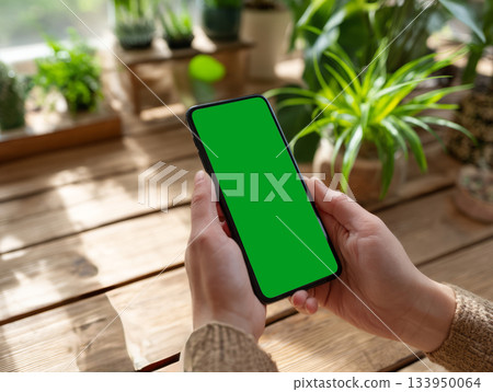 Smartphone mockup in green eco workspace Smartphone mockup in green eco workspace 133950064