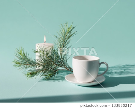 Minimal mint winter composition with white cup and pine branch 133950217