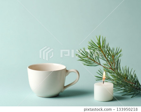 Minimal mint winter composition with white cup and pine branch Minimal mint winter composition with white cup and pine branch 133950218