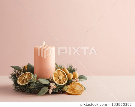 Christmas candle with pine and orange slices 133950392