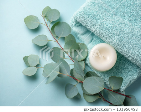 Minimal spa flat lay with eucalyptus and candle Minimal spa flat lay with eucalyptus and candle 133950458