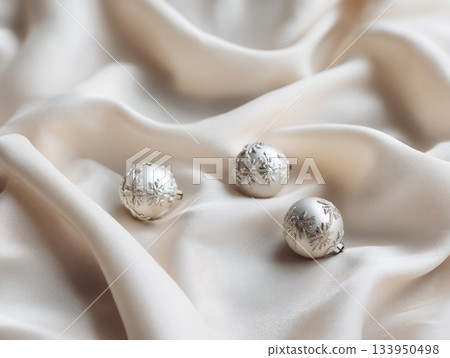 Silver Christmas ornaments on silk fabric Silver Christmas ornaments on silk fabric 133950498