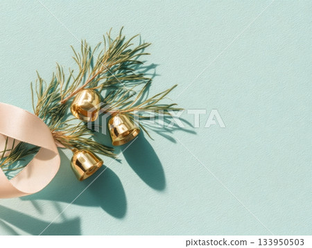 Glass Christmas baubles and golden bells with pine branches 133950503