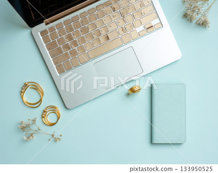 Laptop with coffee and accessories on mint desk Laptop with coffee and accessories on mint desk 133950525