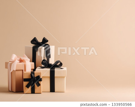 Elegant gift boxes with black and beige ribbons Elegant gift boxes with black and beige ribbons 133950566