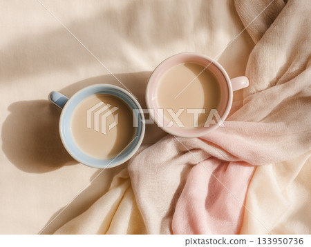 Cozy pastel composition with teacups and scarf 133950736