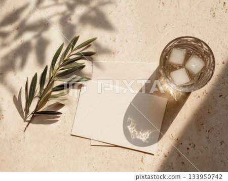 Olive Branch Mockup with Blank Card and Iced Drink on Stone Background 133950742