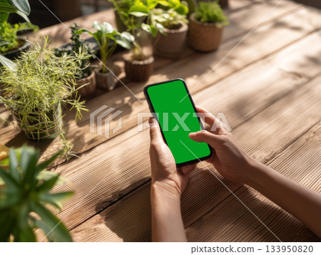 Smartphone mockup in green eco workspace 133950820