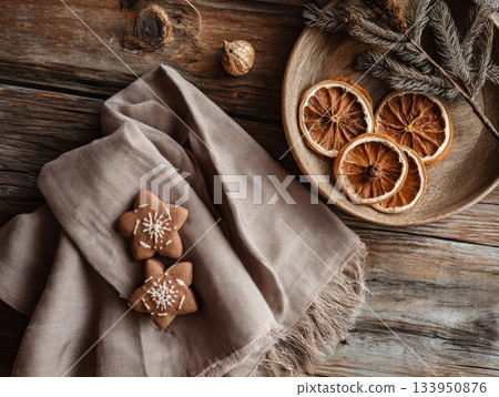 Christmas cookies and dried orange slices on cozy knitted fabric Christmas cookies and dried orange slices on cozy knitted fabric 133950876