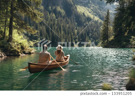 Couple Paddling Canoe on Lake 133951205
