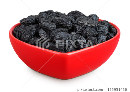 black raisins in ceramic bowl isolated on white background 133951436