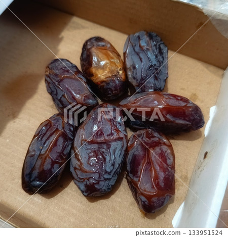 Dates Group in a Cardboard Box Ready to Eat for Healthy Snack or Ramadan Break Fast 133951524