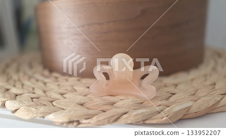 Soft silicone pacifier on woven mat for baby care and comfort 133952207