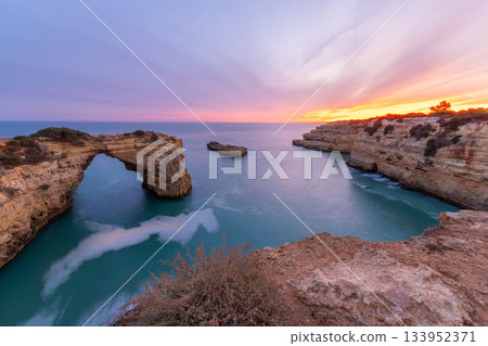 Albandeira Arch near Albandeira Beach, Atlantic Ocean in Evening Twilight. Algarve, Portugal Albandeira Arch near Albandeira Beach, Atlantic Ocean in Evening Twilight. Algarve, Portugal 133952371